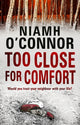 Book cover of: Too Close For Comfort. By: Niamh O'Connor