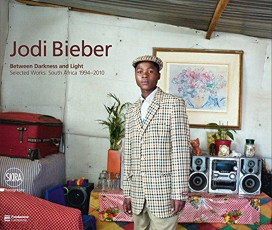 Book cover of: Jodi Bieber: Between Darkness and Light. By: MAGGIA FILIPPO